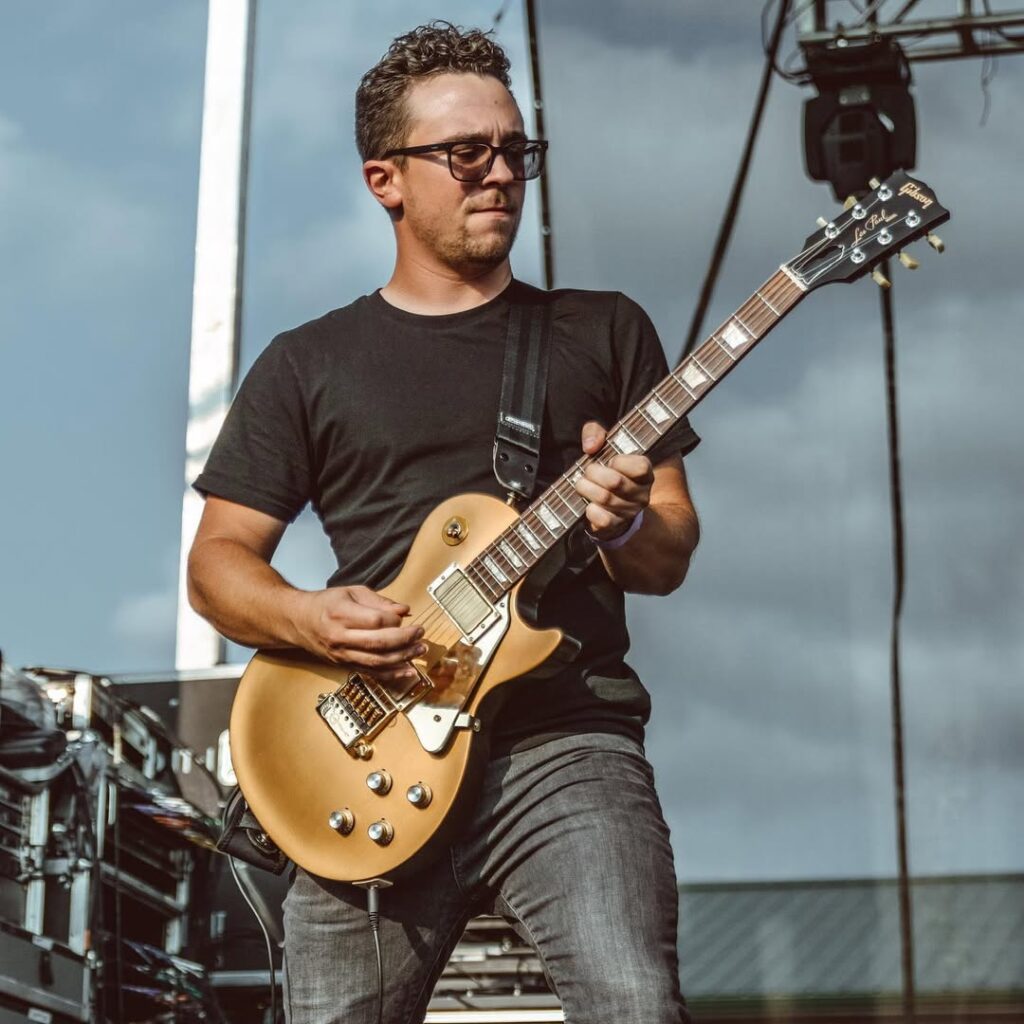 Brandon playing Gold Gibson Les Paul on Stage