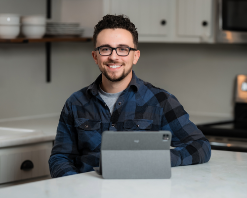 Brandon sitting at the computer